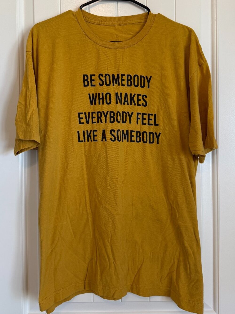 Vibrant mustard yellow graphic tee featuring an inspiring quote.